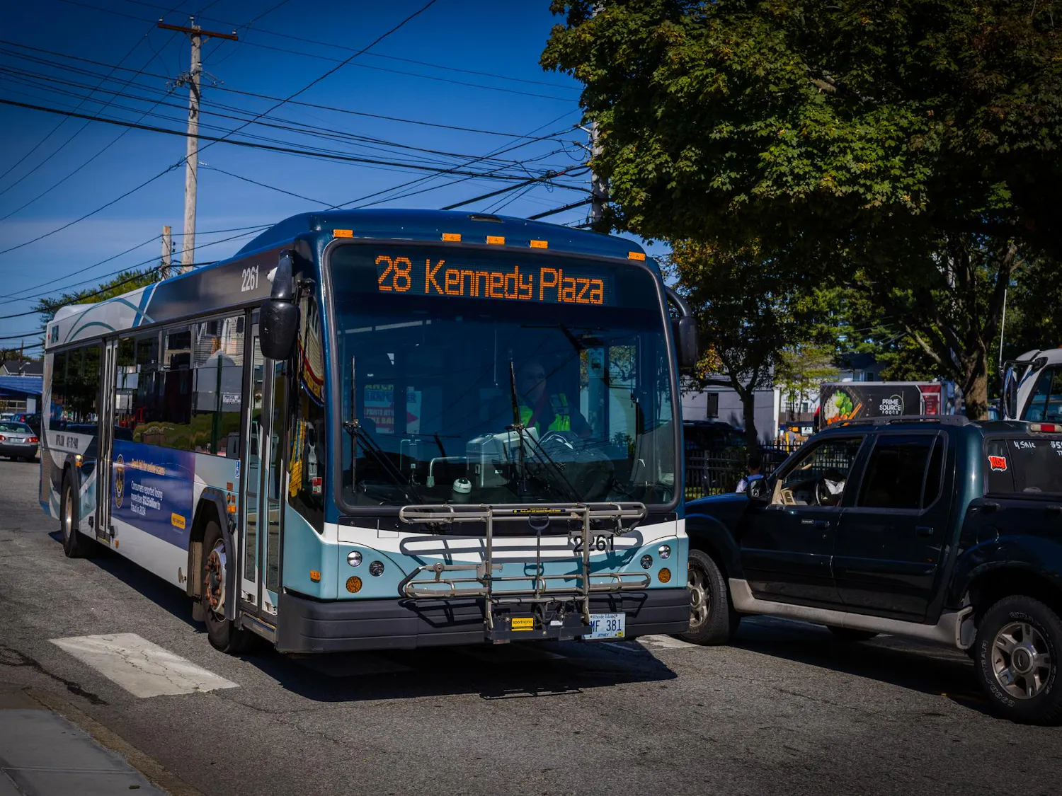 Photo of a bus driving down the street.