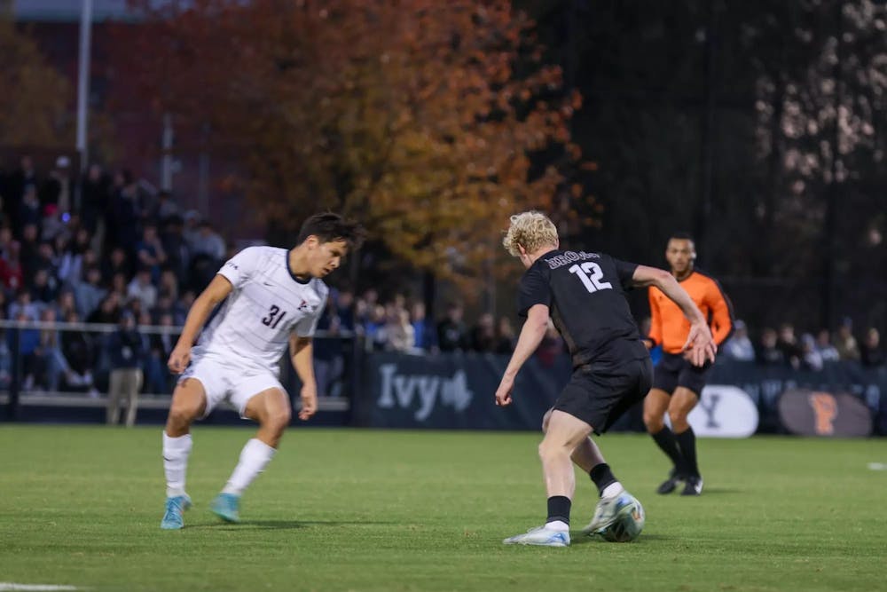 Two players battle on the field.