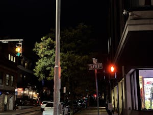 Photo of the intersection of Thayer and Angell streets at night.