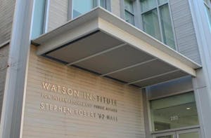 A photo of the Stephen Robert '62 Hall building at the Watson Institute. It is a photo of the Watson sign. 