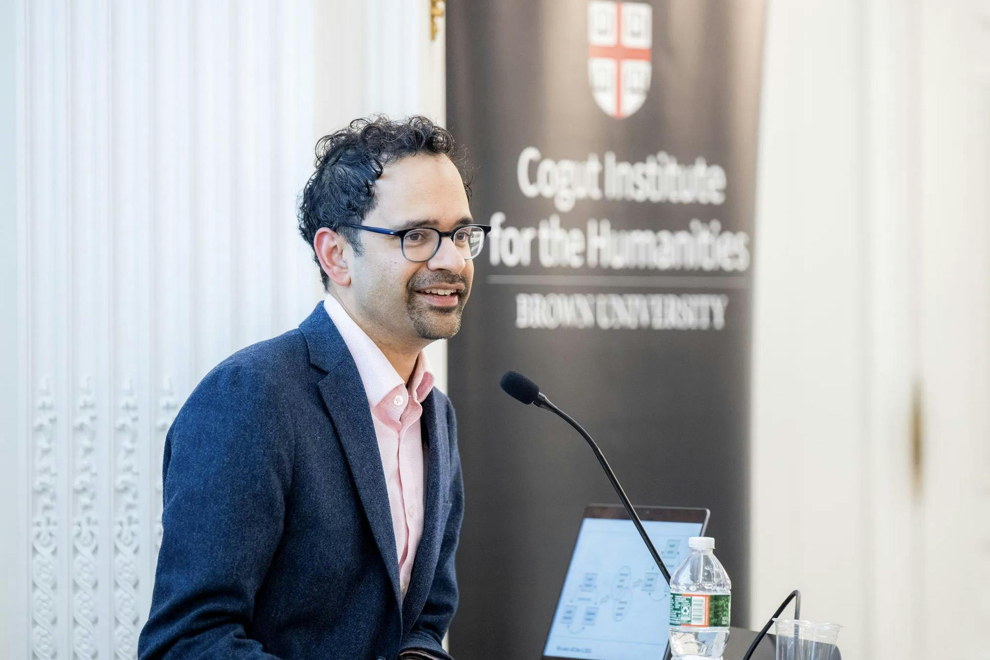 A photo of Yale professor Sunil Amrith speaking at the Cogut Institute for the Humanities.