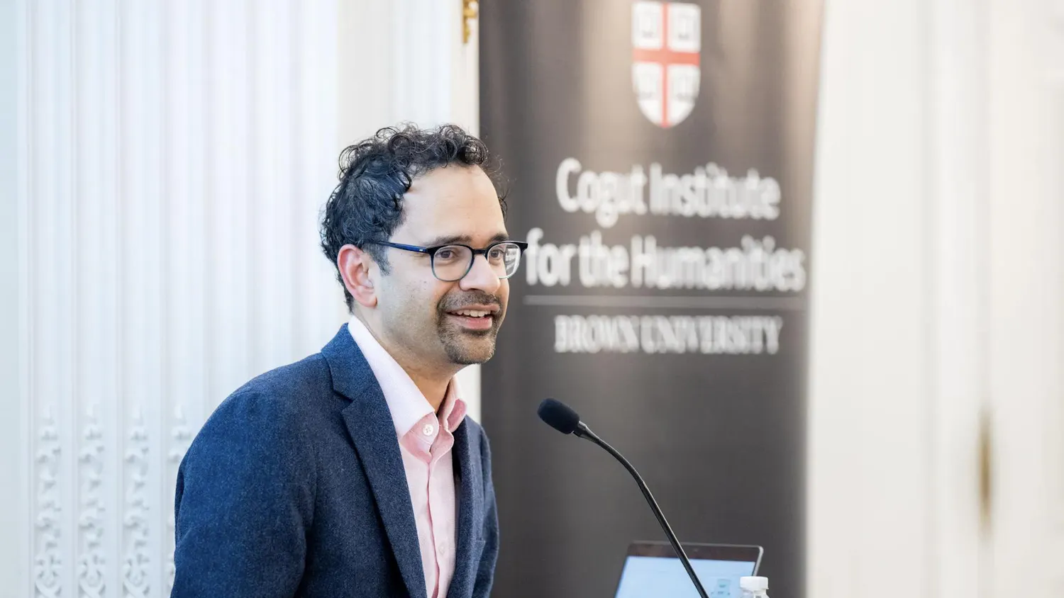A photo of Yale professor Sunil Amrith speaking at the Cogut Institute for the Humanities.