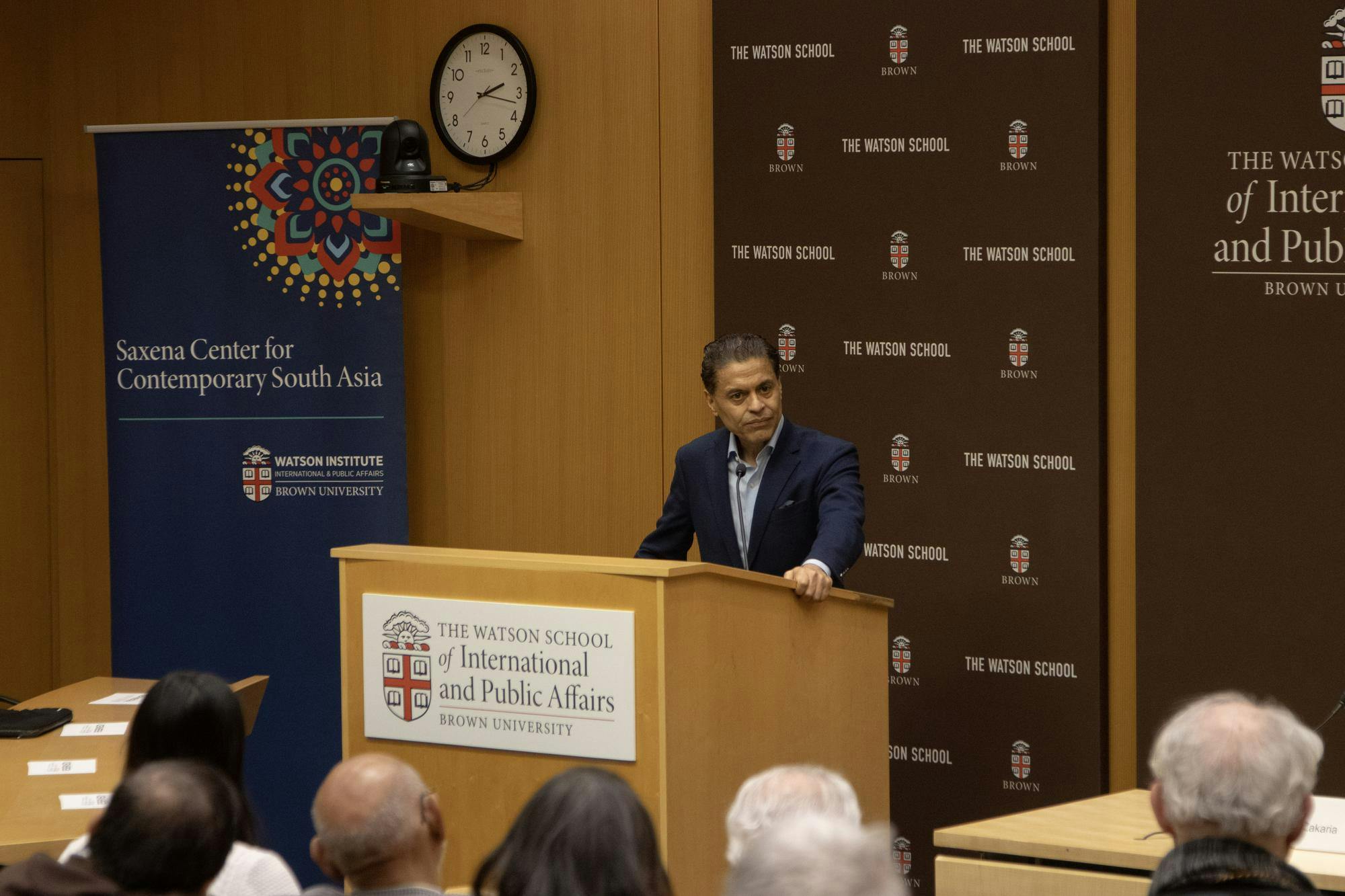 A photo of Fareed Zakaria speaking from a podium at the Watson School for International and Public Affairs. 