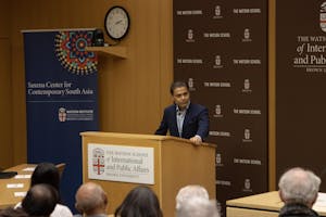 A photo of Fareed Zakaria speaking from a podium at the Watson School for International and Public Affairs. 