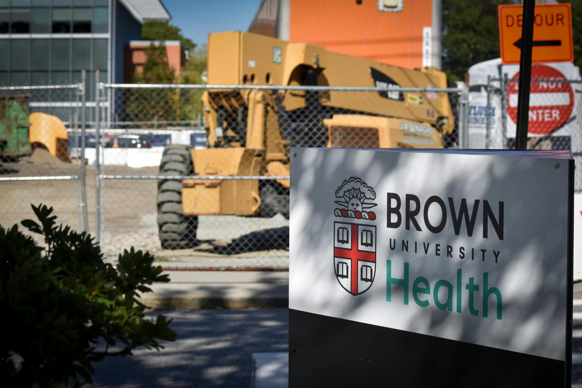 Photo of Brown University Health sign with construction in the background.