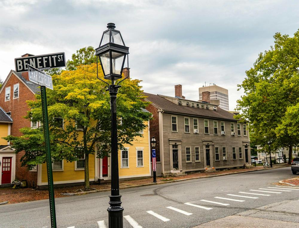 A photo of two colonial-style houses on College Hill at the corner of Benefit and Charlesfield.

