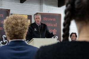 A photo depicts McKee giving a speech to attendees of the event. 