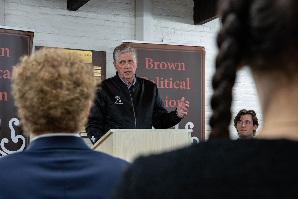 A photo depicts McKee giving a speech to attendees of the event. 
