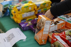 Photo of boxes of girl scout cookies on a table.