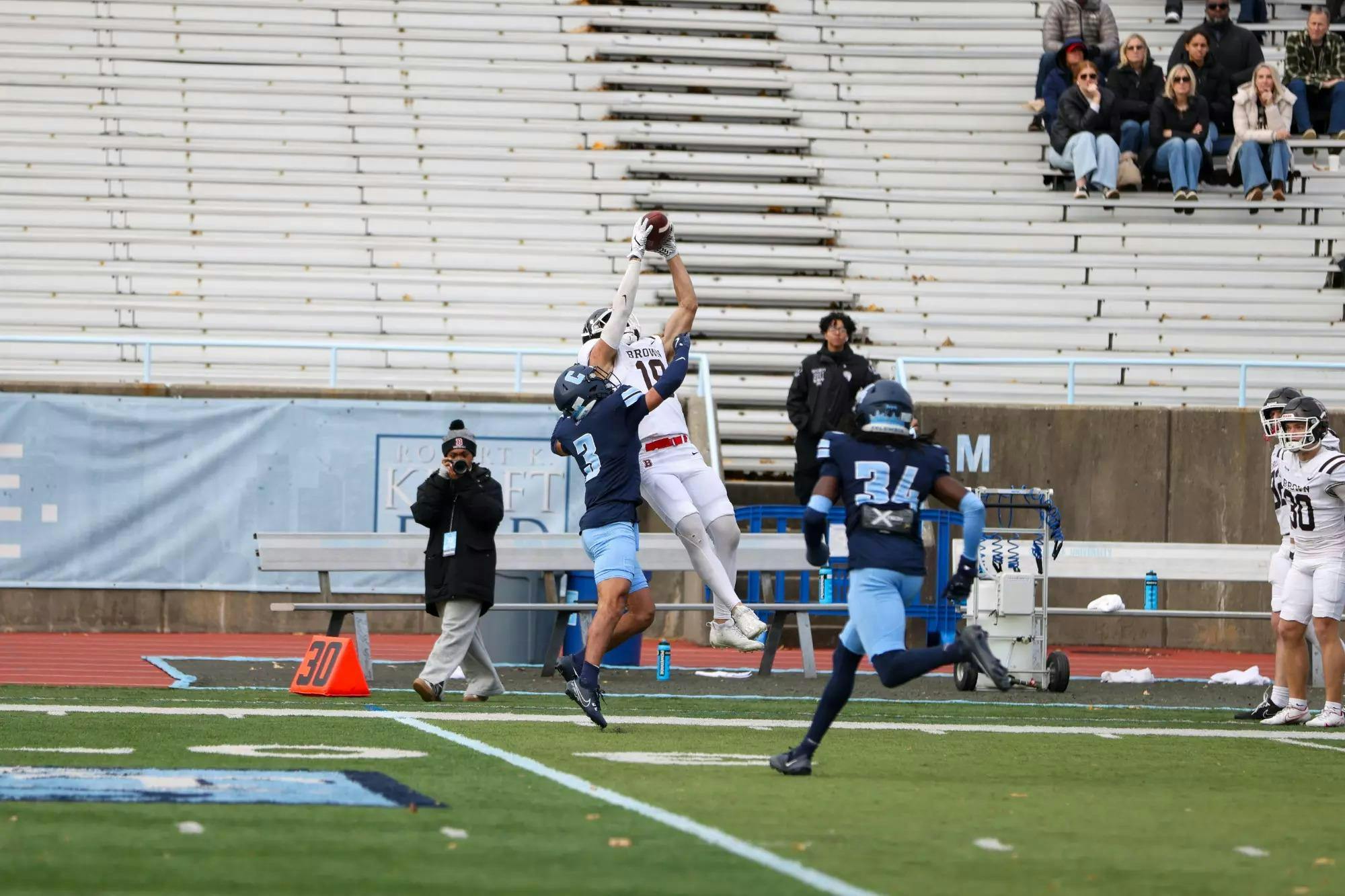 Ty Pezza ’26 jumping to catch a football