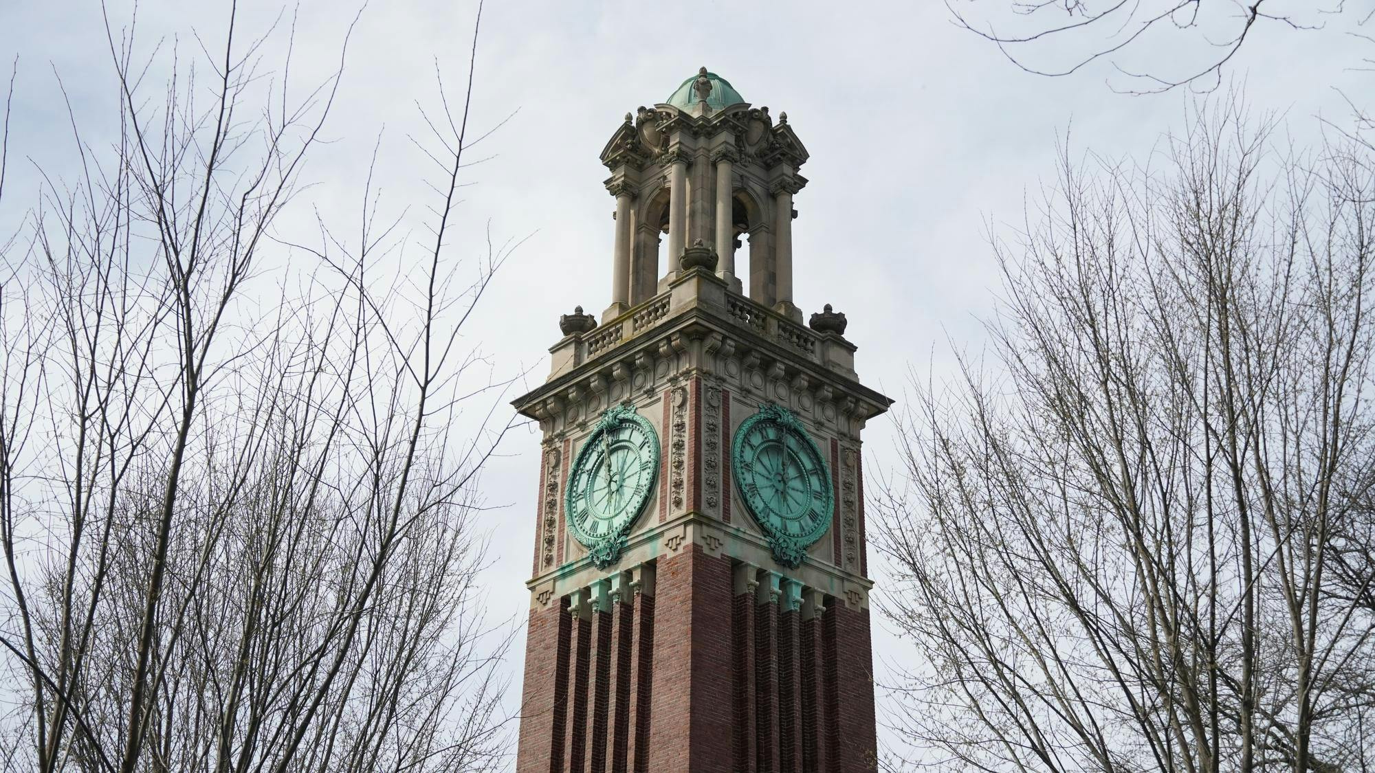 A photo of the top of Carrie Tower against a gray sky. 