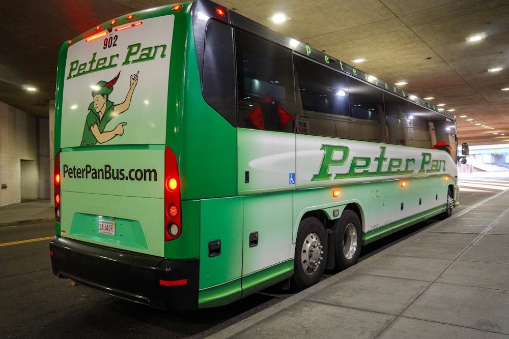 Photograph of a green Peter Pan bus parked at the Providence Downtown stop