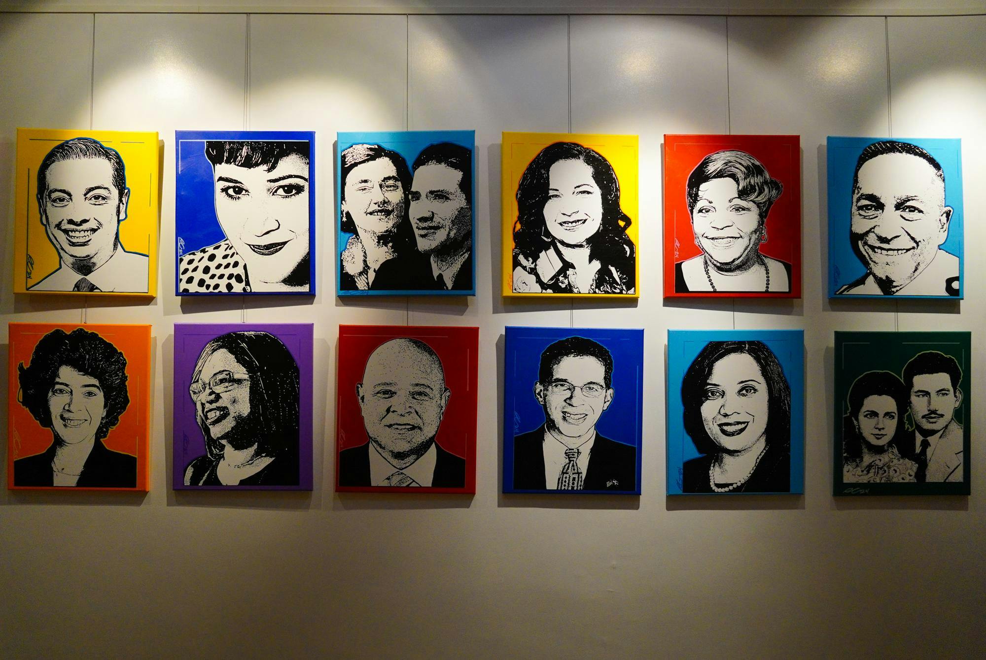 A segment of a Hispanic Heritage Month art exhibit featuring bold printed portraits of trailblazers of the Latino community of Rhode Island.
