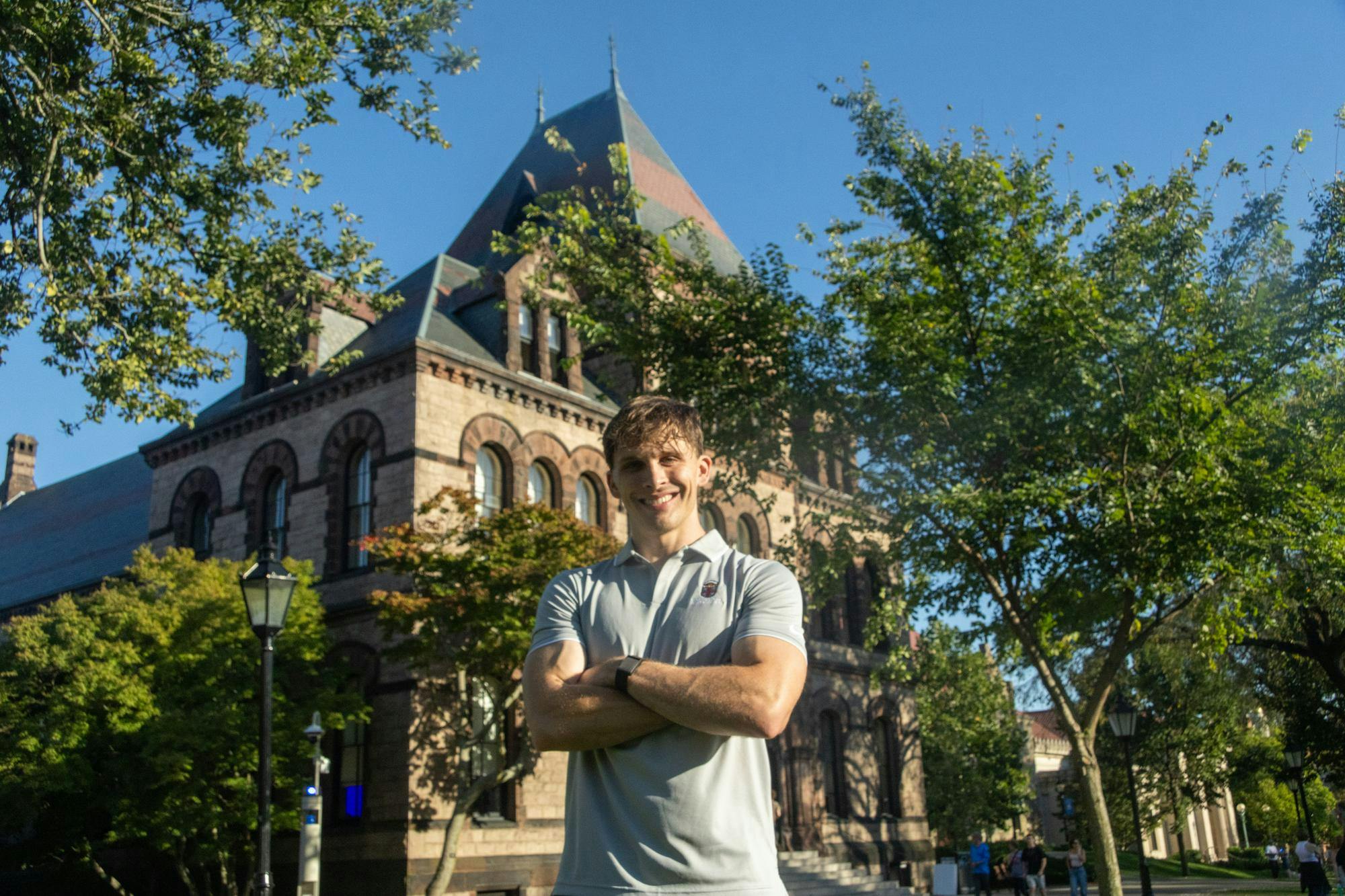 Photo of Blaine Maye in front of Sayles Hall