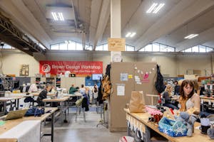 Photo of the Brown Design Workshop with students working at tables.