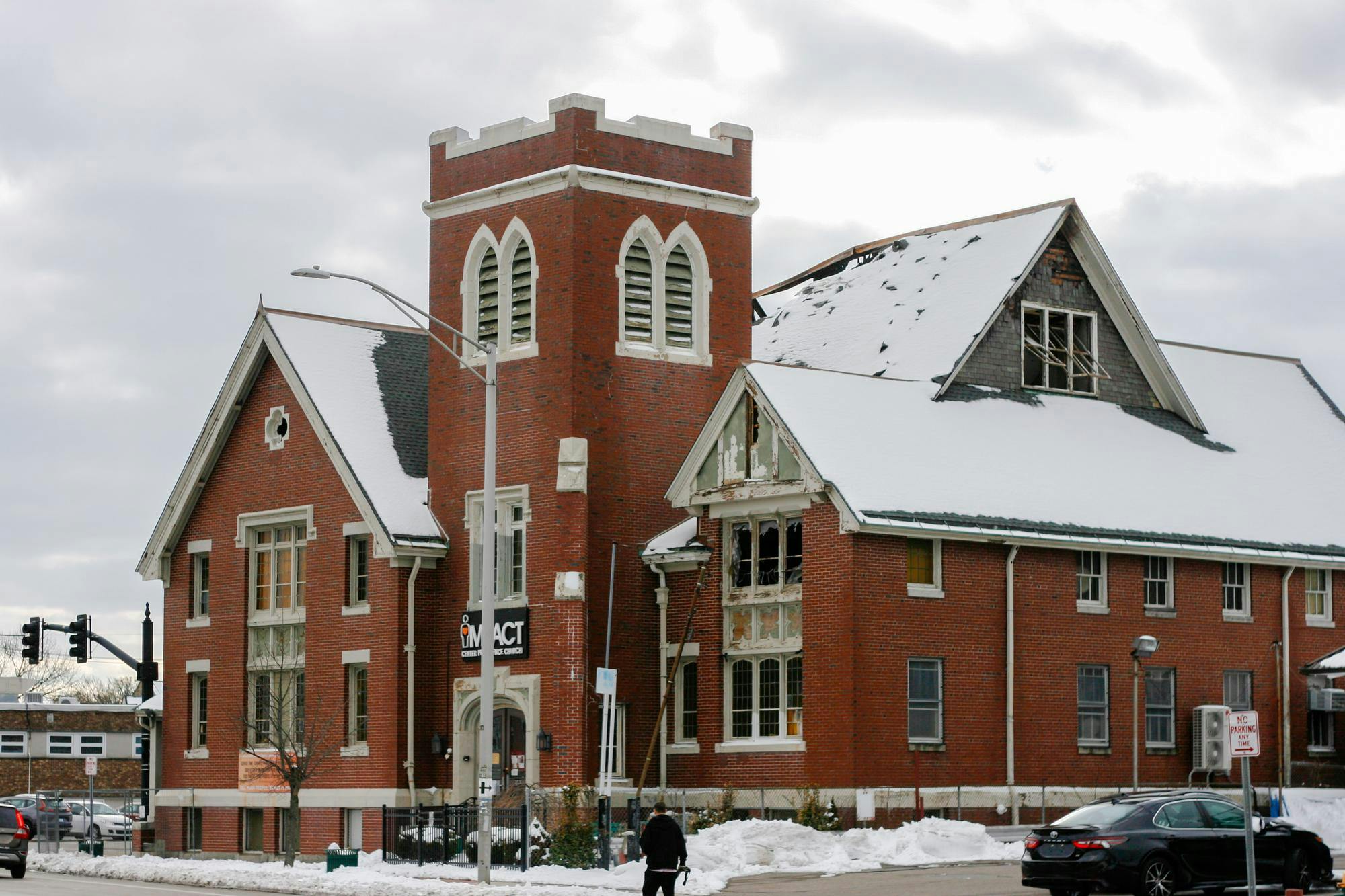 The Impact Center Providence Church on a snowy day. The roof is partially damaged.