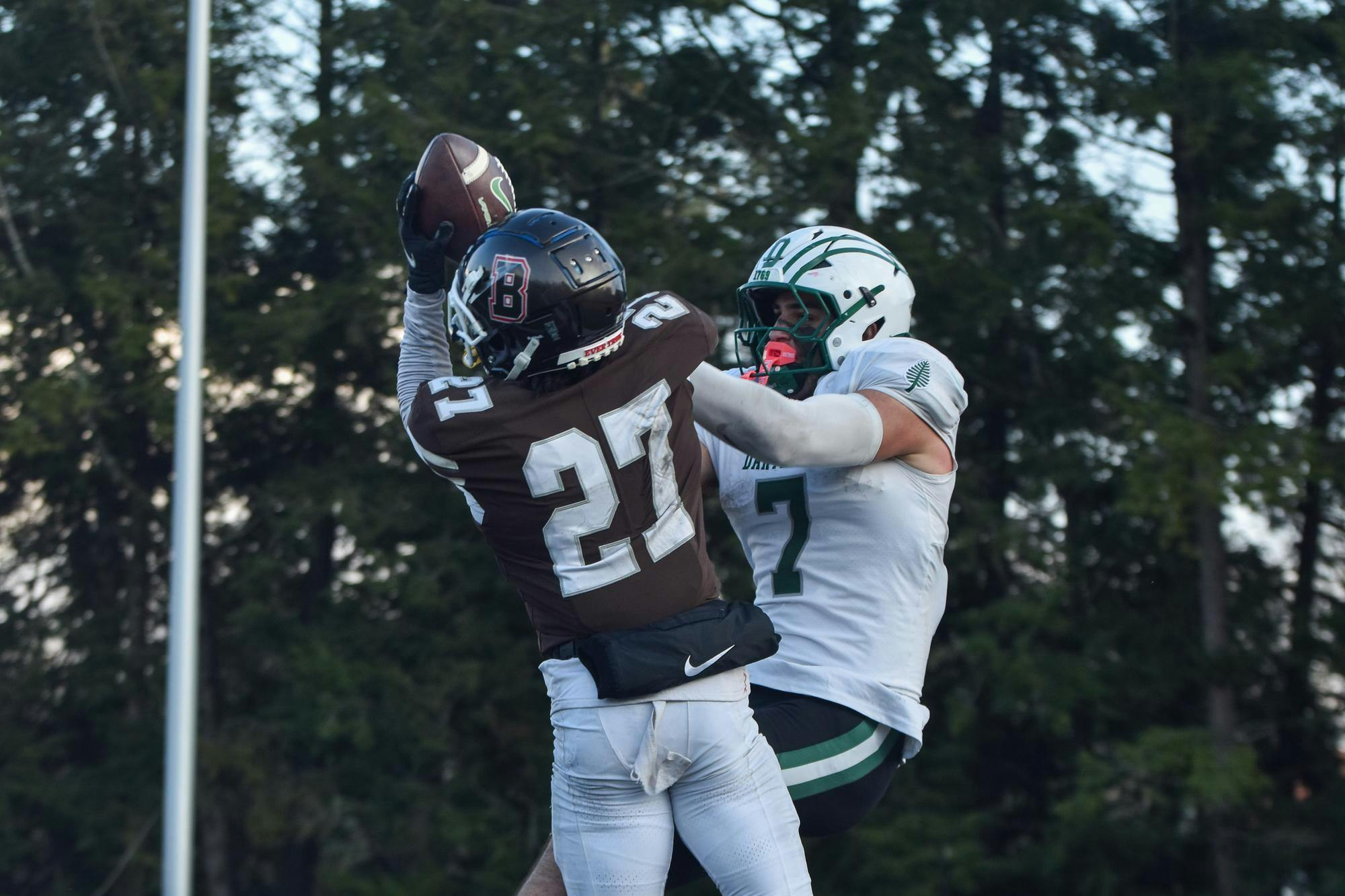 Photo of Bruno cornerback Cap Davis ’27 jumping to intercept a pass.