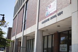 Slanted angle of a brick building that reads, Providence School Dept. 