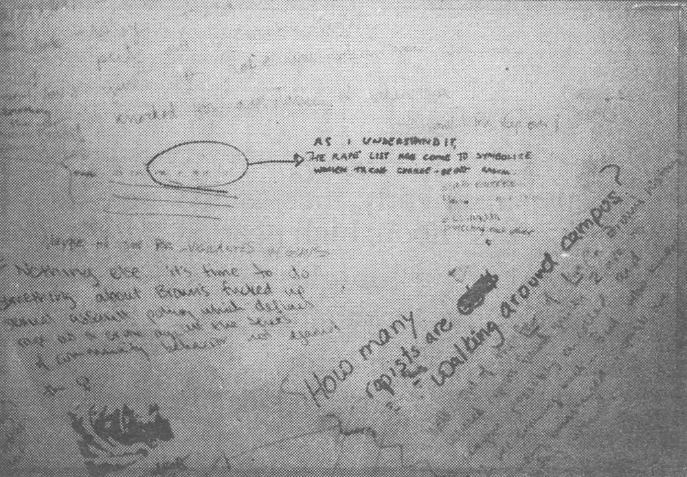 A grainy black and white photo of graffiti on a bathroom stall door.