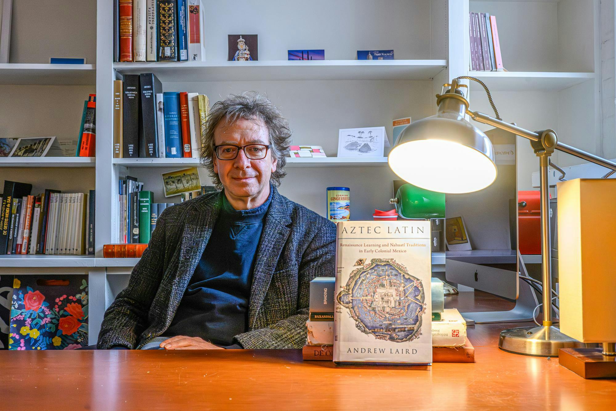 Portrait of Andrew Laird alongside his book “Aztec Latin” on Nov. 14.