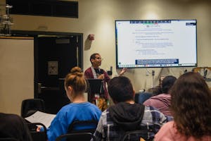 Photo of someone presenting at October 1's Graduate Student Council meeting