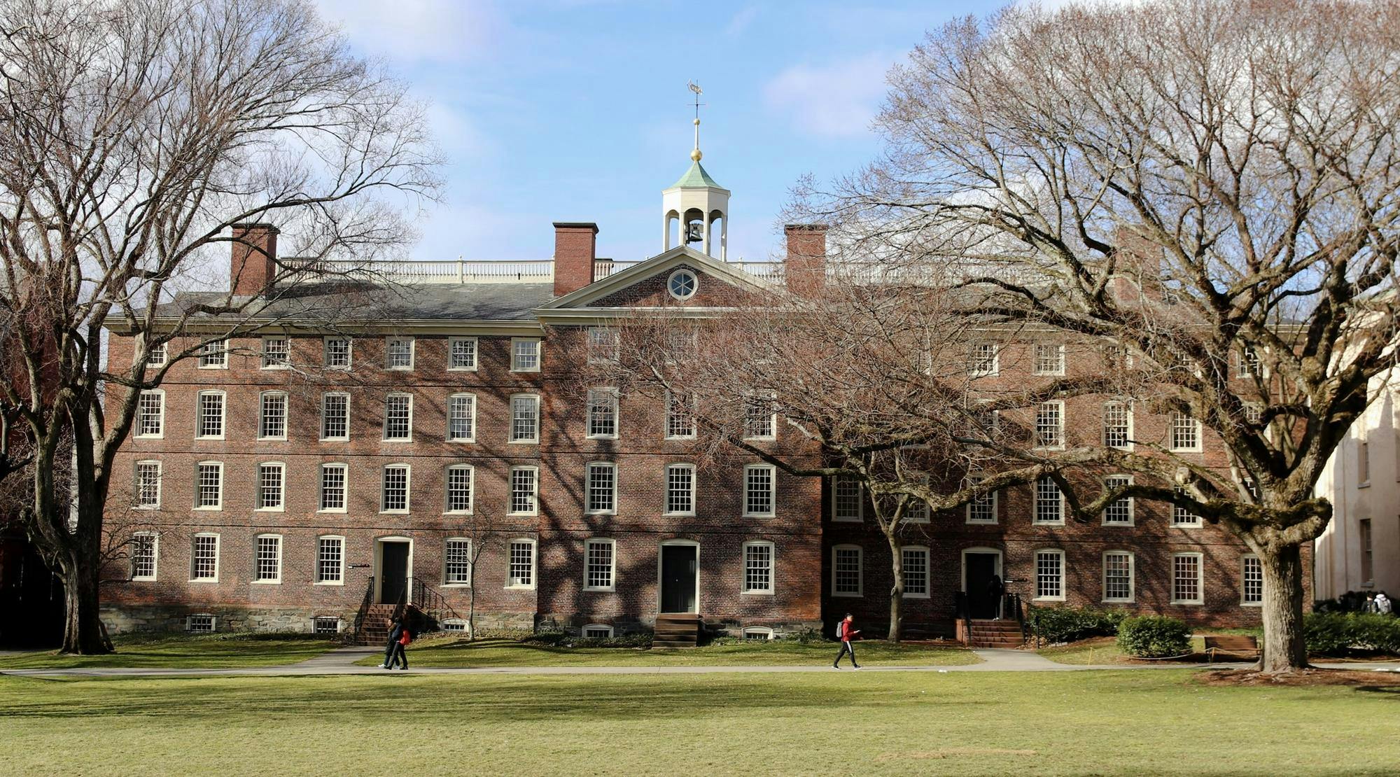    Photo of the front of University Hall on a clear sunny day. 
