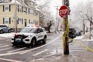 A police car sits on a road near Brown's campus on Dec. 14. 
