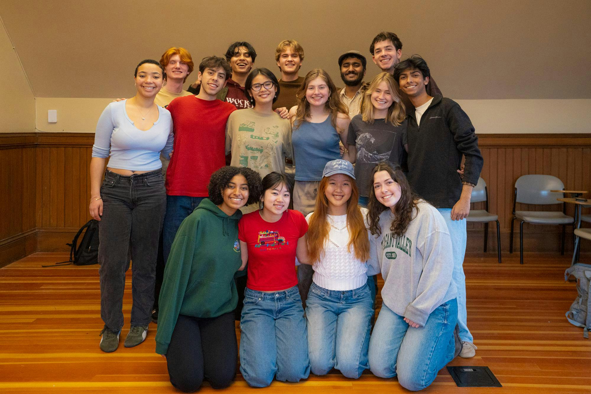 Jabberwocks members stand together for a group picture in a University classroom.