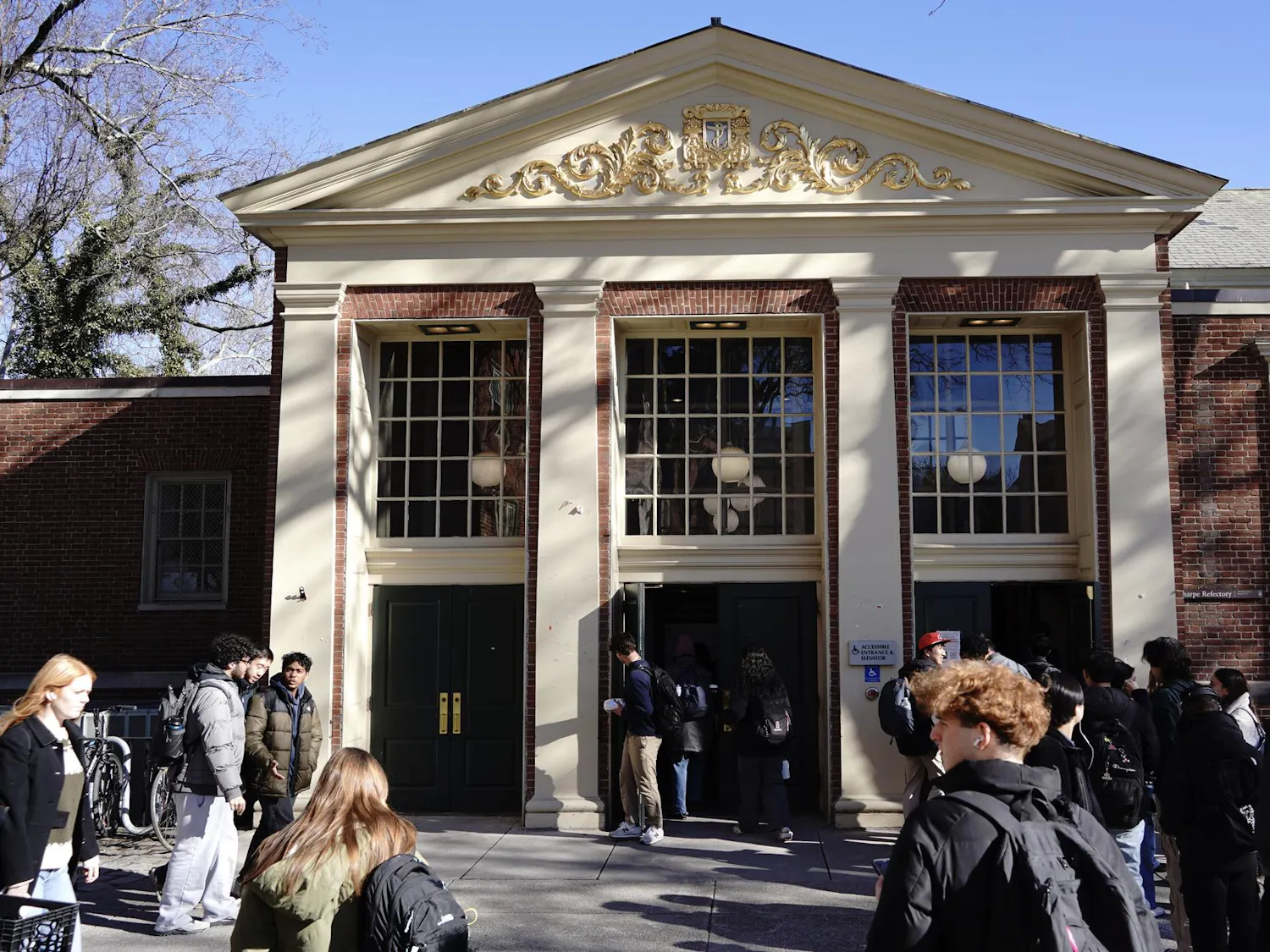 Photo of the front of the Ratty as students walk in and out the building.