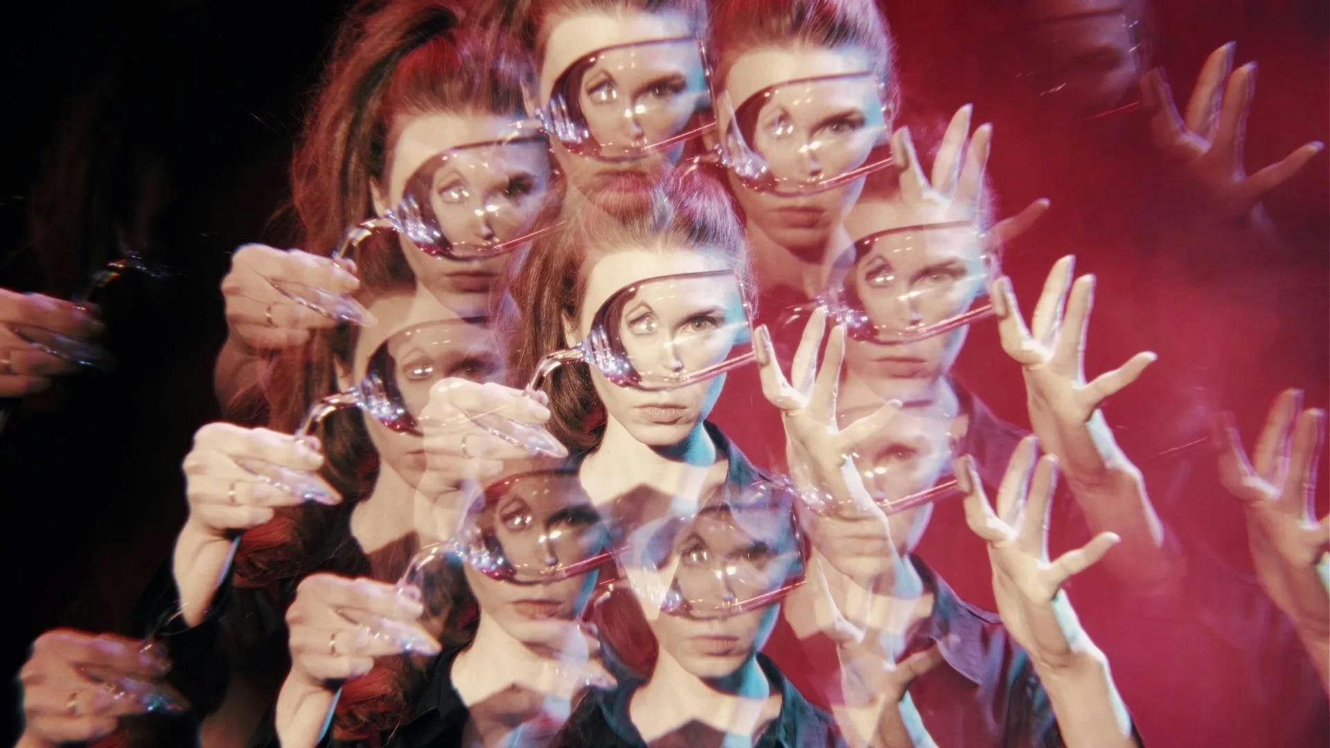 Image of multiple instances of a woman holding up a wine glass over her face, the reflection distorting her eyes, replicated in a kaleidoscopic effect. 