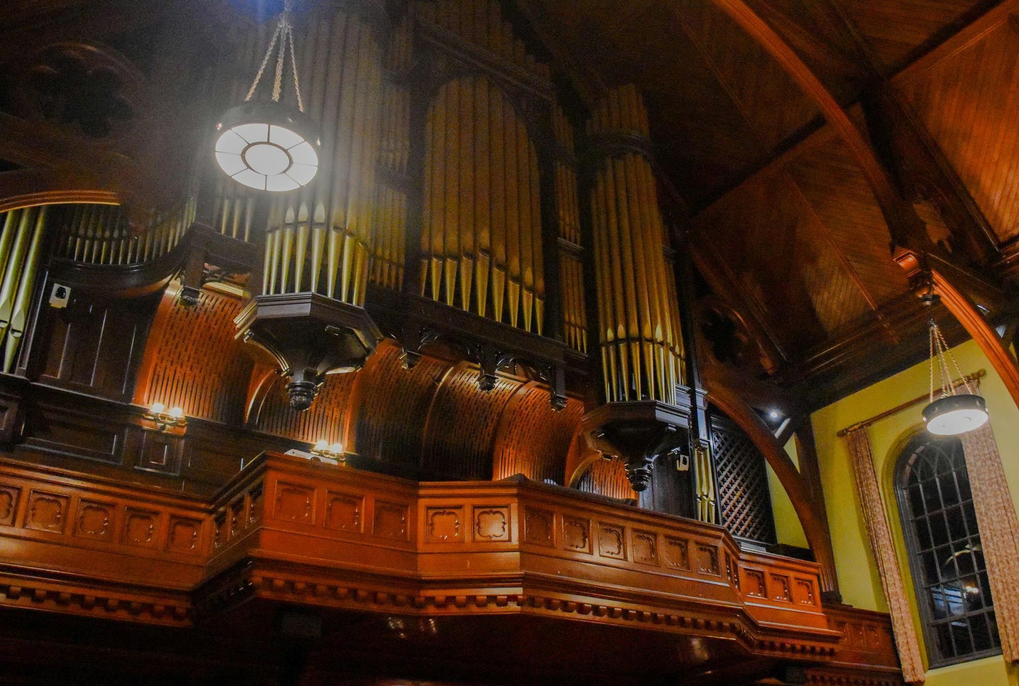 A photo taken from the first floor of Sayles Hall of the Hutchings-Votey pipe organ, which sits on the organ loft. 