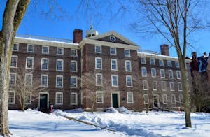 Photo of University Hall during a sunny day with clear skies and snow on the ground.