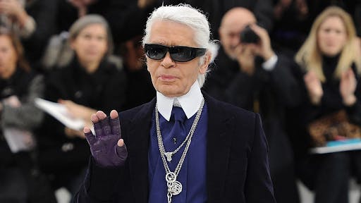 Karl Lagerfeld in his iconic sunglasses and chains | Courtesy: Getty Images, Pascal Le Segretain