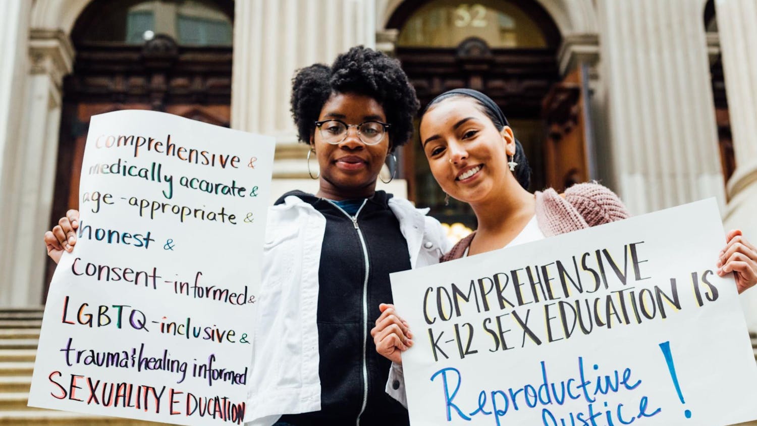 Students holding up signs to promote sex education | Source: NYCLU