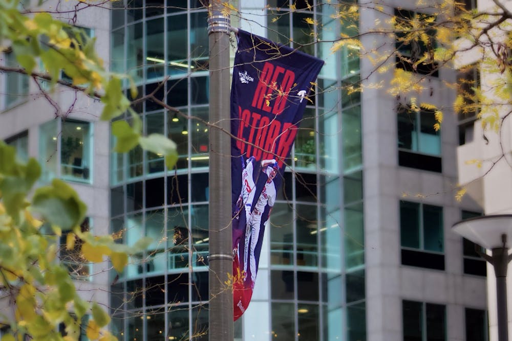 <p>Red October Flag Within Center City | <strong>(</strong>Kasey Shamis/Bullhorn Photographer)</p>