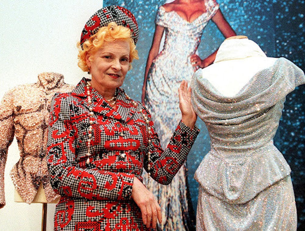 <p>Vivienne Westwood poses with one of her dresses inspired by 18th century France in Vienna | Source: NBC News</p>