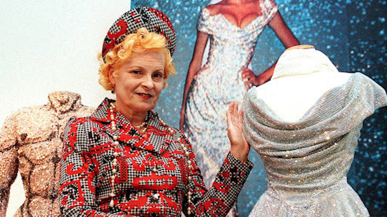 Vivienne Westwood poses with one of her dresses inspired by 18th century France in Vienna | Source: NBC News