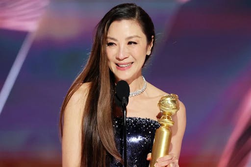 Michelle Yeoh accepts Best Actress at the Golden Globes.