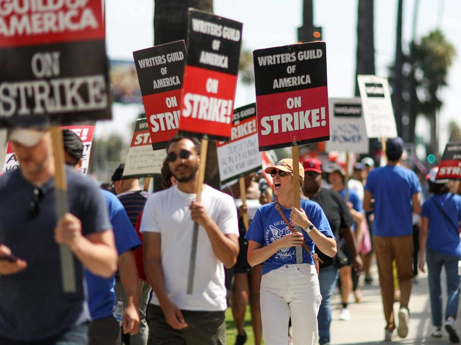 SAG-AFTRA Actors and Writers Guild writers walk the picket line during their strike outside Netflix offices | Courtesy of CNN/Mario Anzuoni