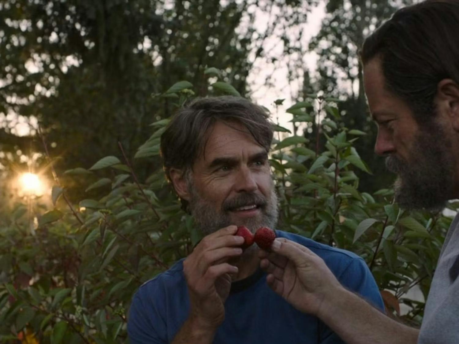 Two men, Bill and Frank, sit outside in their garden eating strawberries | Source: HBO Max The Last of Us (ep: Long, Long Time)