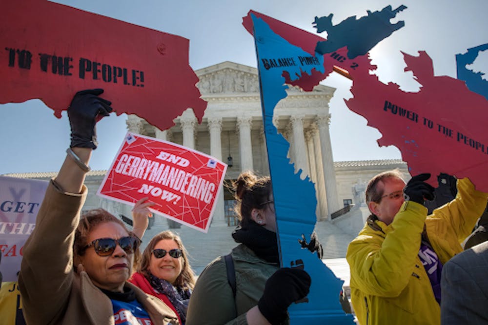 <p>Protestors of gerrymandering outside the supreme court last March | Courtesy: The Washington Post, Evelyn Hockstien </p>