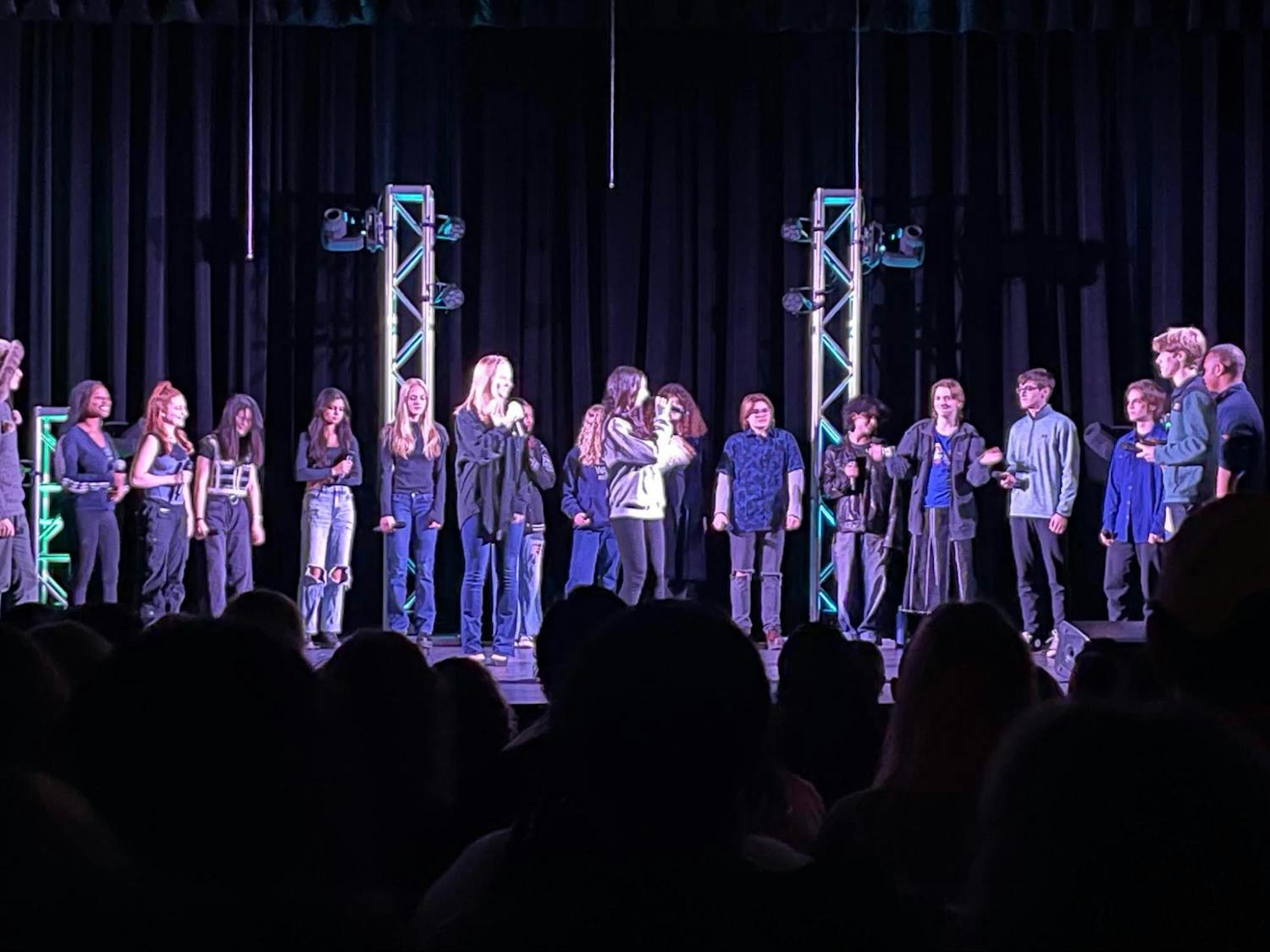 GFS a cappella performing in front of a full auditorium for the annual GFS a cappella invitational fest in February | Source: Germantown Friends School 