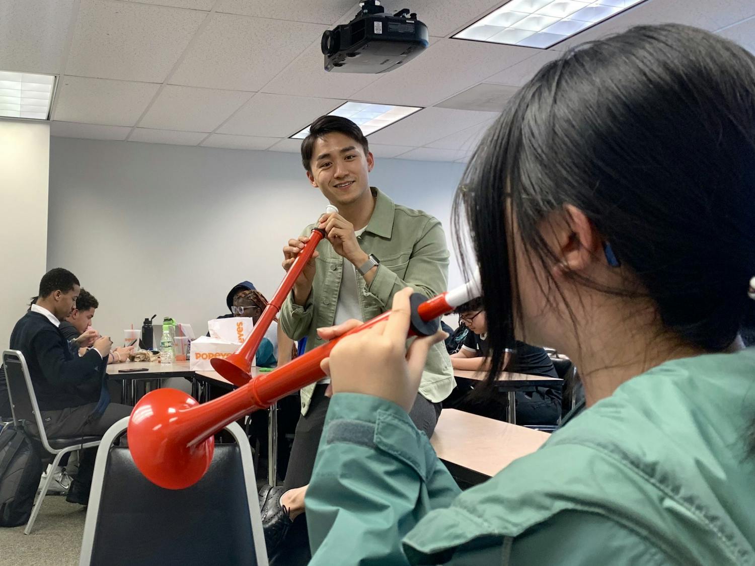 Nozomi Imamura playing the pBuzz with a Project 440 Student | Courtesy: Jennifer Tran