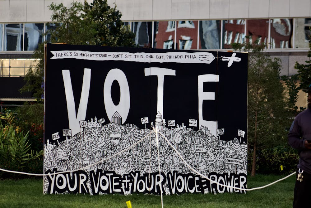 <p>Poster at temporary voting engagement exhibit displayed at Love Park |<strong> (</strong>Kasey Shamis/Bullhorn Photographer)</p>