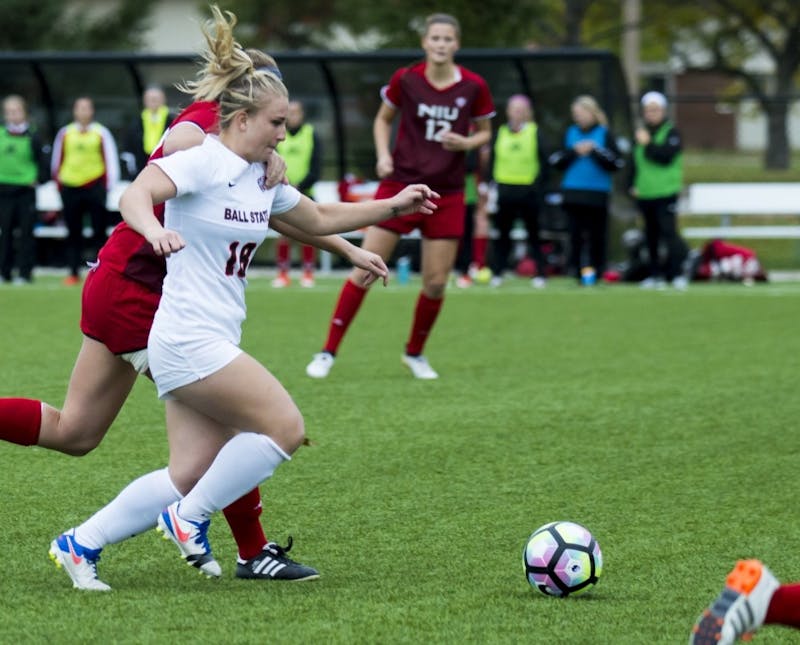 Junior Midfielder Emily Scott attempts to kick the ball away from Northern Illinois University on Oct. 30, 2017 at Briner Sports Complex.&nbsp;Teri Lightning Jr., DN