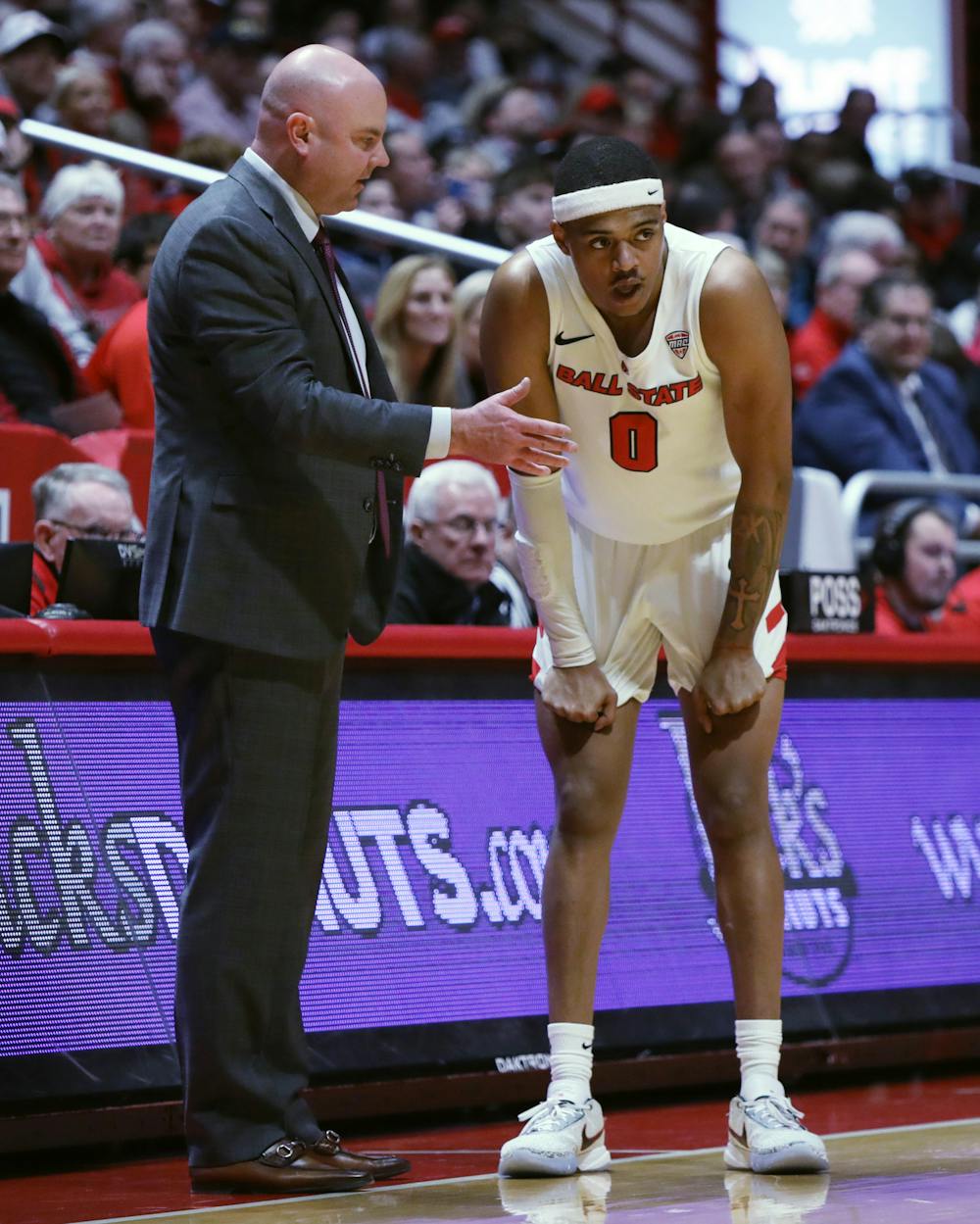 Ball State Men's Basketball Head Coach Michael Lewis (left) talks to redshirt-junior guard Jarron Coleman (right) from the sidelines in a game against Kent State Feb. 21 at Worthen Arena. Ball State defeated Kent State 82-70. Amber Pietz, DN