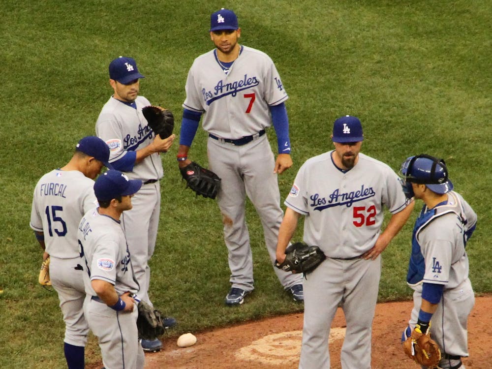 Multiple L.A. Dodgers players stand around the pitching mound, April 24, 2010. Flickr, Photo Courtesy