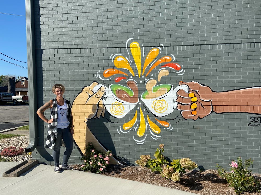 Local artist paints murals to bring Muncie’s southside community together
