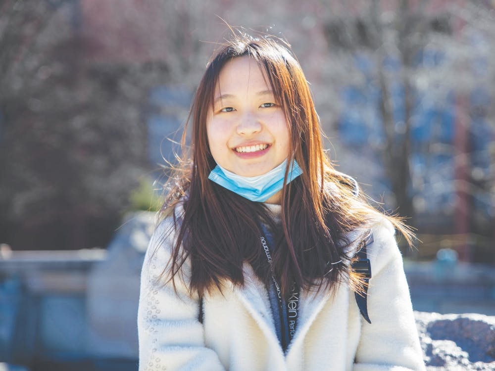 Senior journalism major Shiyi Sun smiles in front of Frog Baby March 2, 2021. Sun will graduate from Ball State in May and has already purchased her plane ticket back home to China. Jaden Whiteman, DN