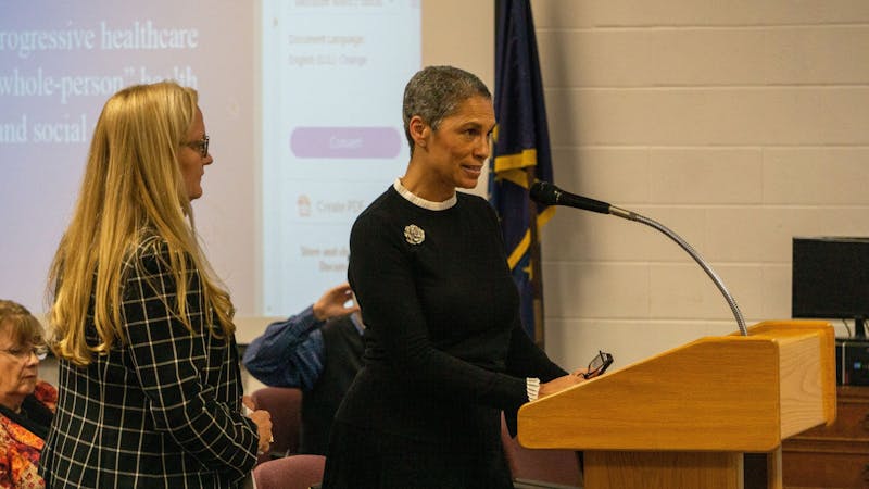 (Left to right) Meridian Health Services' Lisa Suttle, regional vice president of clinical services, and Tracy Douglas-Wheeler, vice president of community health, speak Jan. 14, 2020, at the Muncie Community Schools board meeting. Pending application and approval from the Health Resources and Services Administration, Southside Middle School might have its own health center before May. John Lynch, DN